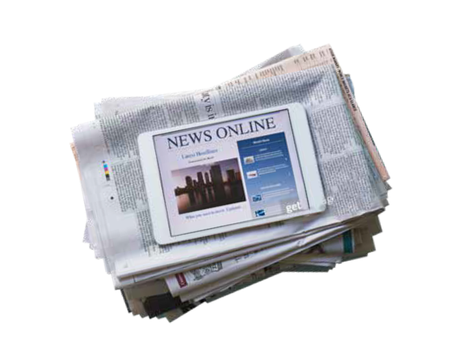 Stack of newspapers with ipad on top